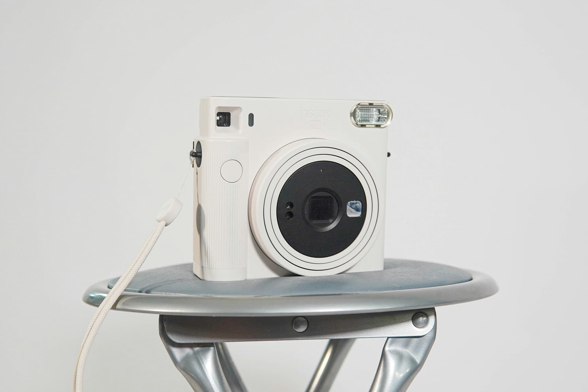 A white film camera with large lens