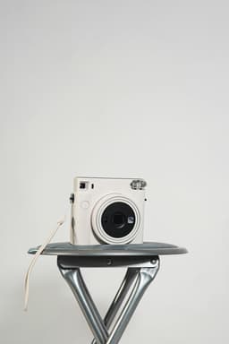 A white film camera with large lens